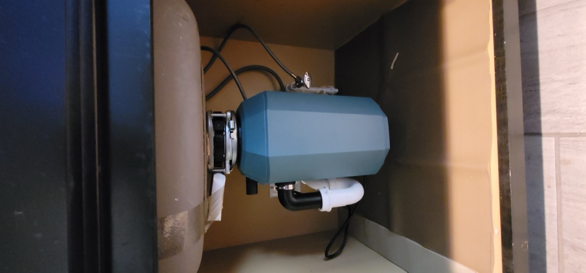 Garbage disposal installed under kitchen sink in Las Vegas home